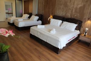 Cama ou camas em um quarto em Aria Beach Resort by Hana Turismo