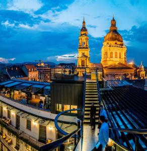 a view of the city of lyon at night at Aria Hotel Budapest by Library Hotel Collection in Budapest