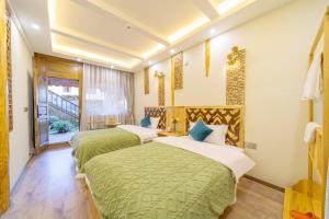 GeGeHouse - Lijiang Old Town客房内的一张或多张床位