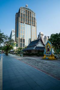 a street in a city with tall buildings at GO INN Silom - BTS Surasak station in Yan Nawa