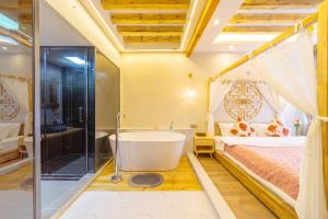 a bathroom with a tub and a bedroom with a bed at Gegewu Inn - Lijiang Ancient Town in Lijiang