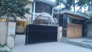 a gate in front of a house at Decent Palace in Lahore