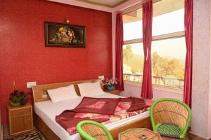 Postel nebo postele na pokoji v ubytování DWARIKA HOTEL