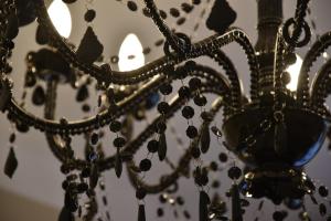 a chandelier with beads on it at Hotel Waldperle in Göhren