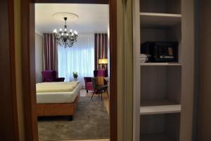 En eller flere senge i et værelse på Hotel Waldperle