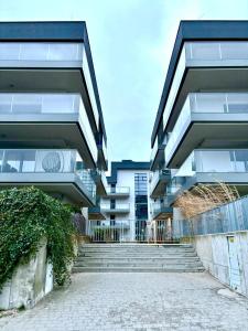 a building with a staircase in front of it at Apartament21 in Dziwnów