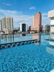 a swimming pool on top of a city skyline at Chamber suites klcc by Hibernate in Kuala Lumpur