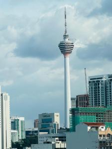 a view of the space needle in a city at Chamber suites klcc by Hibernate in Kuala Lumpur