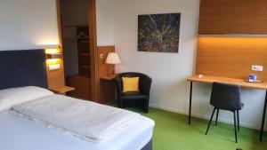 Postel nebo postele na pokoji v ubytování Hotel & Fitness Castello