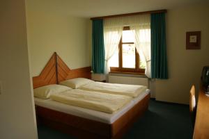 Postel nebo postele na pokoji v ubytování Hotel & Fitness Castello