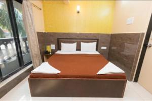 Postel nebo postele na pokoji v ubytování Hotel classic residency