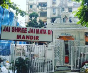 a sign that reads la slice la maza dh mandir at Hotel classic residency in Mumbai