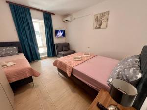 Postel nebo postele na pokoji v ubytování Guesthouse Civovic