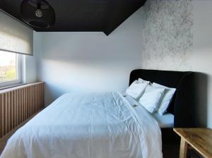 Postel nebo postele na pokoji v ubytování L'appart by Authentic