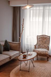 a living room with a couch and a coffee table at Yiwu Holly Hotel in Yiwu