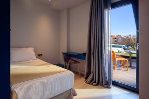 Postel nebo postele na pokoji v ubytování Essence Hotel
