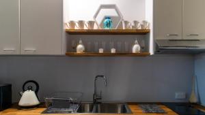 a kitchen with a sink and a counter top at Magic Oak Getaway in Marysville +13 photos