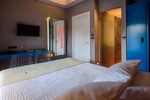 Postel nebo postele na pokoji v ubytování Essence Hotel