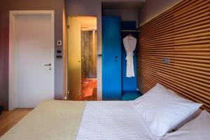 Postel nebo postele na pokoji v ubytování Essence Hotel