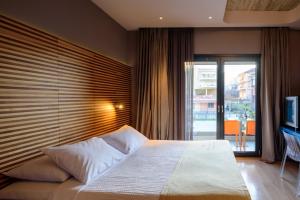 Postel nebo postele na pokoji v ubytování Essence Hotel