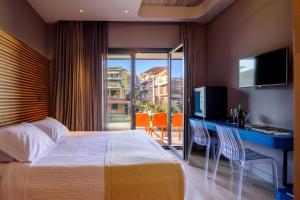 Postel nebo postele na pokoji v ubytování Essence Hotel