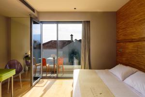 Postel nebo postele na pokoji v ubytování Essence Hotel