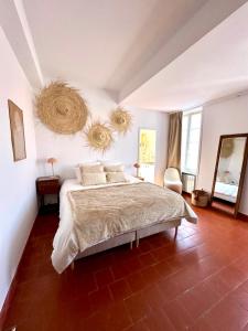 Ένα ή περισσότερα κρεβάτια σε δωμάτιο στο Grande Maison familiale Leucate Village
