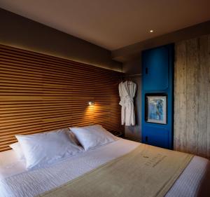 Postel nebo postele na pokoji v ubytování Essence Hotel