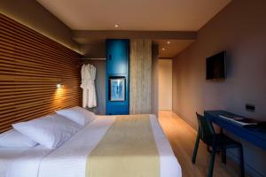 Postel nebo postele na pokoji v ubytování Essence Hotel
