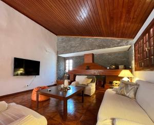 a living room with a couch and a table at Finca León in Santa Brígida