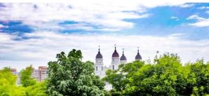 a building with three domes on top of trees at Hotel Ipsilanti in Iaşi