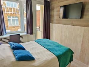 Postel nebo postele na pokoji v ubytování Hotel Sfinx