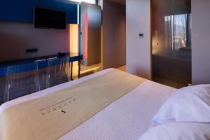 Postel nebo postele na pokoji v ubytování Essence Hotel