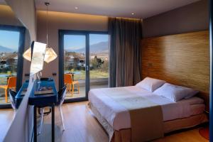 Postel nebo postele na pokoji v ubytování Essence Hotel