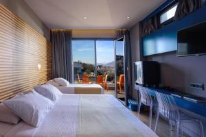 Postel nebo postele na pokoji v ubytování Essence Hotel