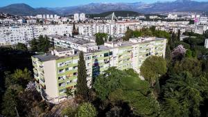 an aerial view of a large white building at Apartment Mona in Podgorica