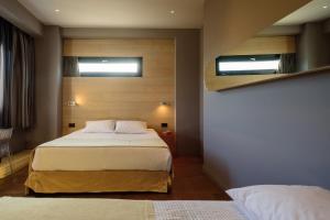 Postel nebo postele na pokoji v ubytování Essence Hotel