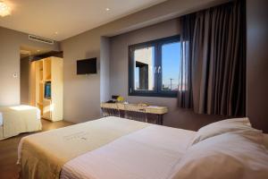 Postel nebo postele na pokoji v ubytování Essence Hotel