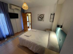 Postel nebo postele na pokoji v ubytování Sueños de Lorca Guest House