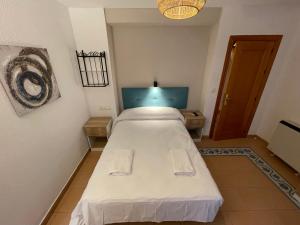Postel nebo postele na pokoji v ubytování Sueños de Lorca Guest House