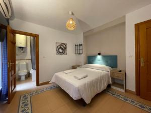 Postel nebo postele na pokoji v ubytování Sueños de Lorca Guest House