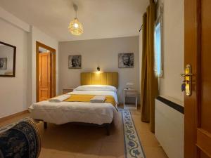 Postel nebo postele na pokoji v ubytování Sueños de Lorca Guest House
