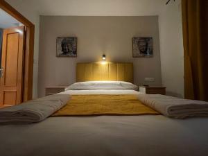 Postel nebo postele na pokoji v ubytování Sueños de Lorca Guest House