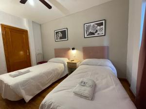 Postel nebo postele na pokoji v ubytování Sueños de Lorca Guest House