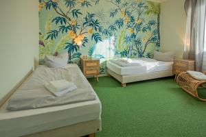 Postel nebo postele na pokoji v ubytování WannerHus Hotel