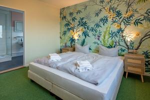 Postel nebo postele na pokoji v ubytování WannerHus Hotel