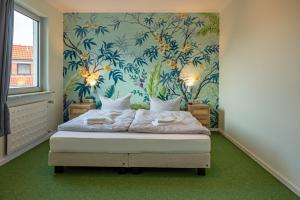 Postel nebo postele na pokoji v ubytování WannerHus Hotel