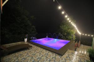 a swimming pool at night with lights on it at Acasa Panorama Homestay in Vĩnh Phúc