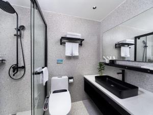 Koupelna v ubytování Yiwu Holly Hotel