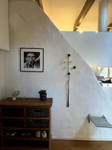 a room with a wall with a picture of a man at Spacious Penthouse close to center in Stockholm +9 photos
